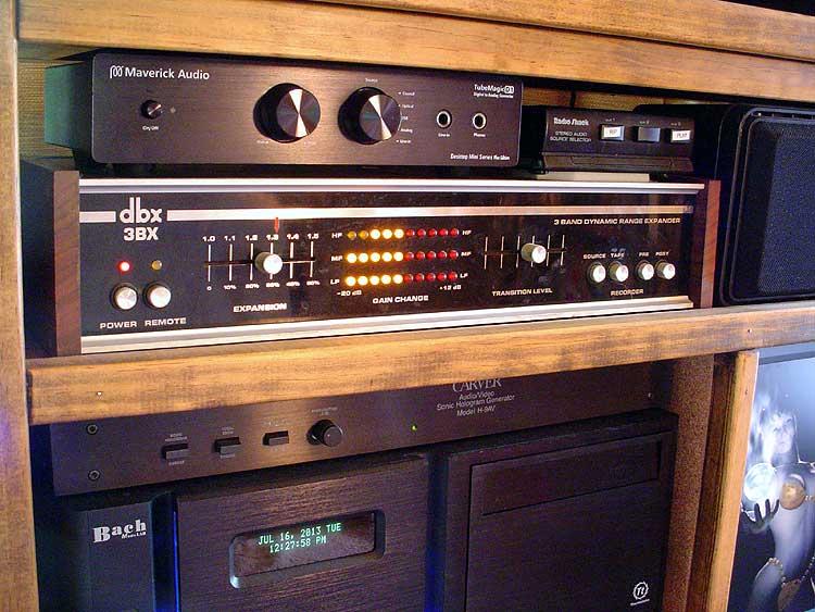 dbx.jpg - The dbx 3BX is a spacial enhancer that restores the original dynamic range of the source material based on sonic cues encoded even into old recordings. Three bands allow it to boost each target area as needed without pumping. Above that is a Maverick D1+ TubeMagic DAC - my favorite new toy. Integrates the new digital output of the HTPC seamlessly with the old school analog system.