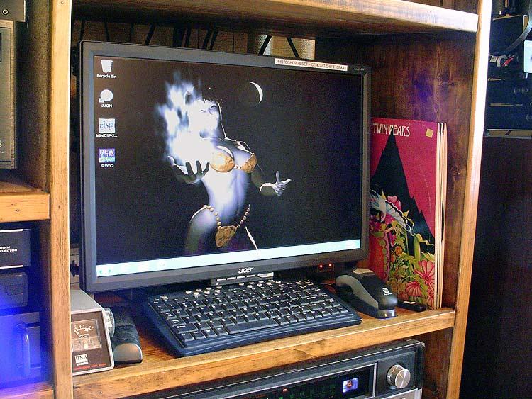 monitor.jpg - The digital control center includes a large monitor so I can comfortably scan the library from the great comfy chair. Input is provided courtesy of a wireless keyboard and mouse.