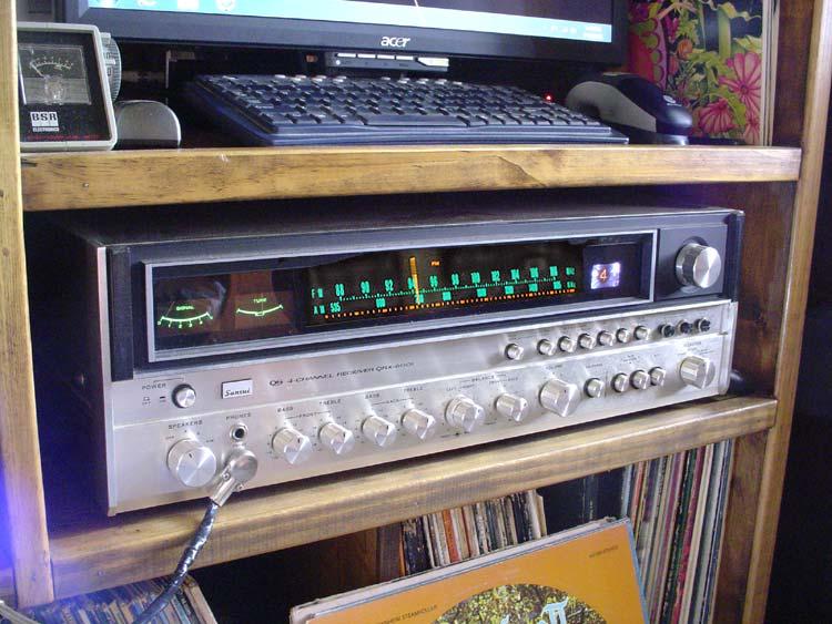 sansui-qrx6001.jpg - The analog heart of the system is currently a Sansui QRX-6001. I picked this up cheap on that auction site to use while it's big brother (a QRX-9001) undergoes a complete makeover. Problem is, the 6001 does everything just as well as the big one, having the exact same vario matrix quad encoding system, and there hasn't been much incentive to get to work on the 9001. The only thing I use the built in amps for is the rear channels, as the front channels are driven into a McIntosh MC2205 via a tape loop.