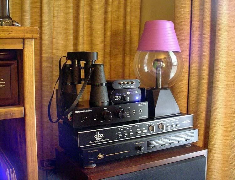 snr1-art.jpg - The dbx SNR-1 on the bottom of the pile was originally made as a sound reduction device for tape, but is also excellent for dropping the noise floor on vinyl. I use this regularly for playback and ripping. Above that is the external phono stage (Art DJ PreII) that allows me to do that. There's also a spare Maverick D1 DAC and dbx 200 switcher. And ... drumroll please ... Devo Plasma Ball!